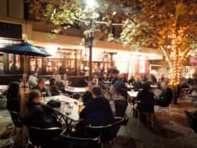 Beer garden full of patrons at night