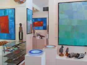Large, colourful paintings by Kubbitji Kngwarreye on exhibition at Aboriginal Dreamings Gallery