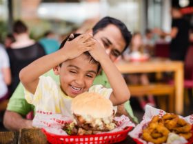 Father and son enjoying their meal