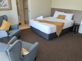 Queen Bed with lounge chairs