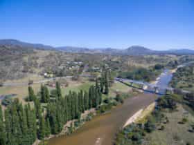 aerial photo of the Murrumbidgee river with the Tharwa Bridge crossing it