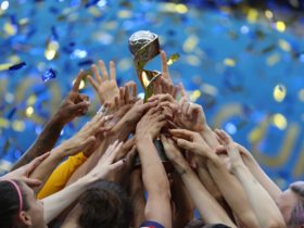 Team USA celebrating with the FIFA Women's World Cup trophy