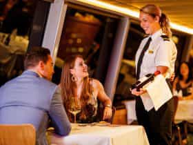 Waitress explaining wine