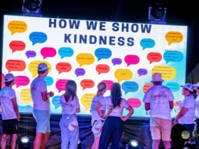 Kindness Festival volunteers team reading attendees messages at the end of the event