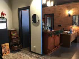 reception desk stylized as a detective desk and photobooth area