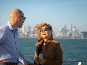 Passengers smiling and laughing onboard Port Phillip Ferries