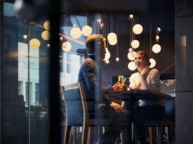 Couple happily eating at restaurant