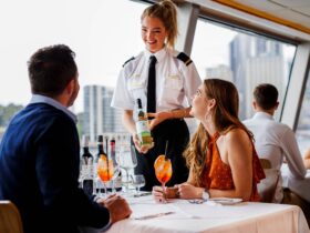 Waitress presenting Australian wine to couple