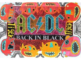 A mural featuring AC/DC back in black writing